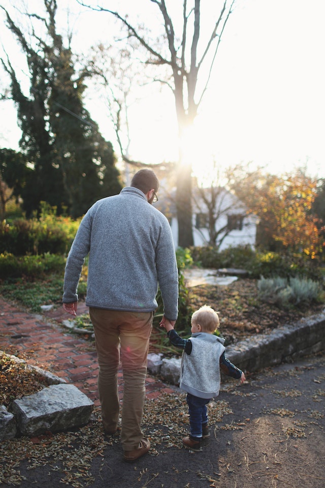 man walking with son